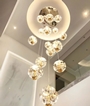 Bộ đèn chùm thông tầng TH540, mâm  inox gương trắng, gồm 55 quả thả tự do tích hợp led, mâm hình vuông  KT(mm): 1000 x 1000 x 3500